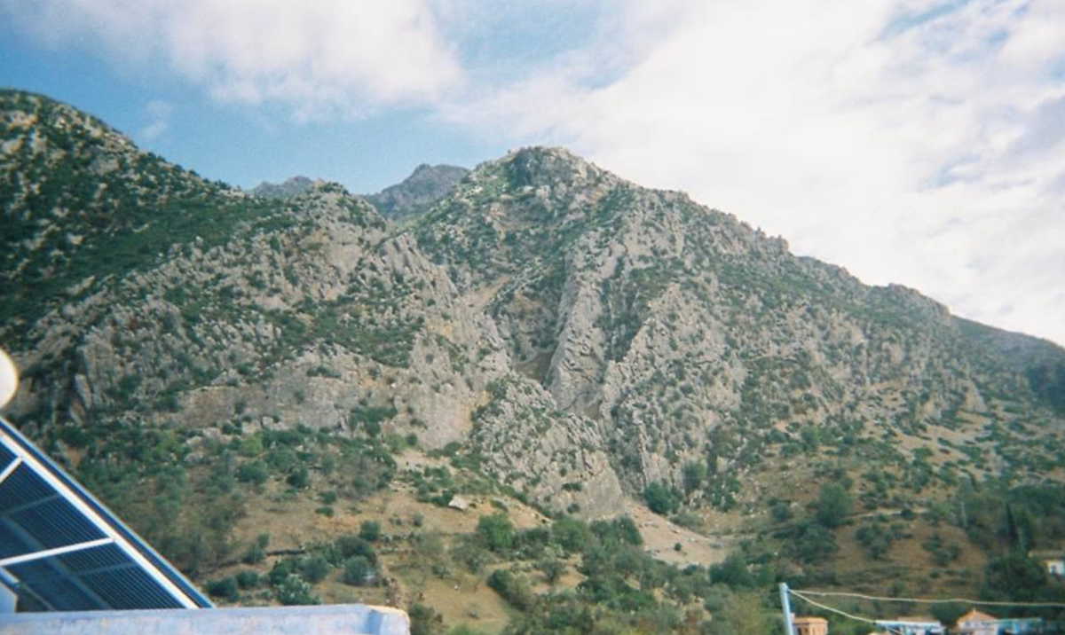 Rugged mountain range under a bright blue sky
